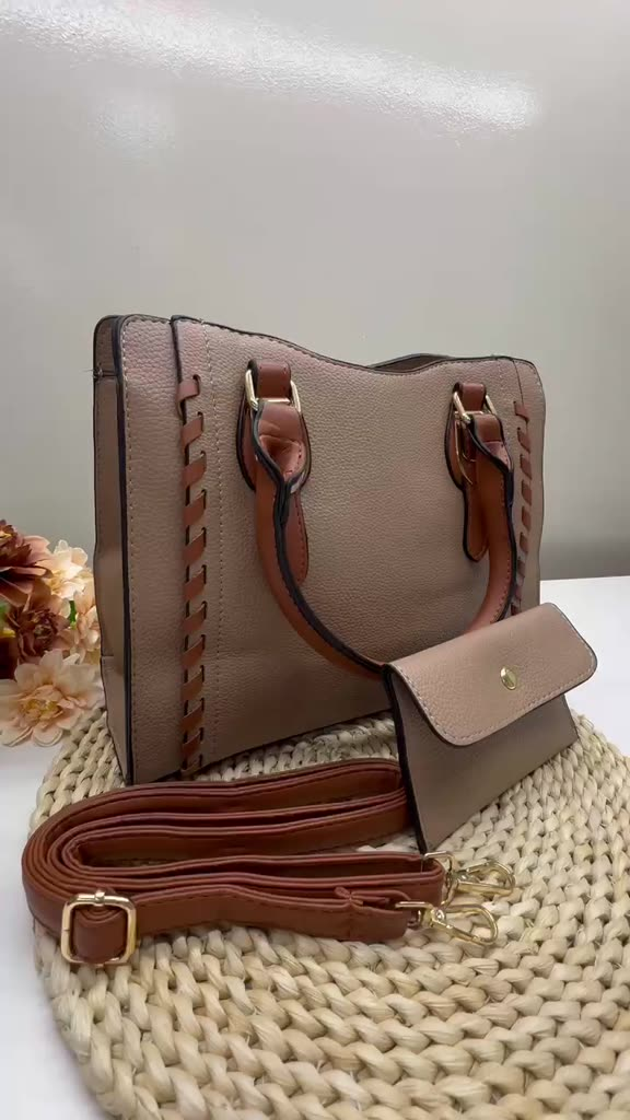 Bolsa feminina prática de grande capacidade com alcas destacaveis e ajustaveis incluindo uma carteira de fecho de botao